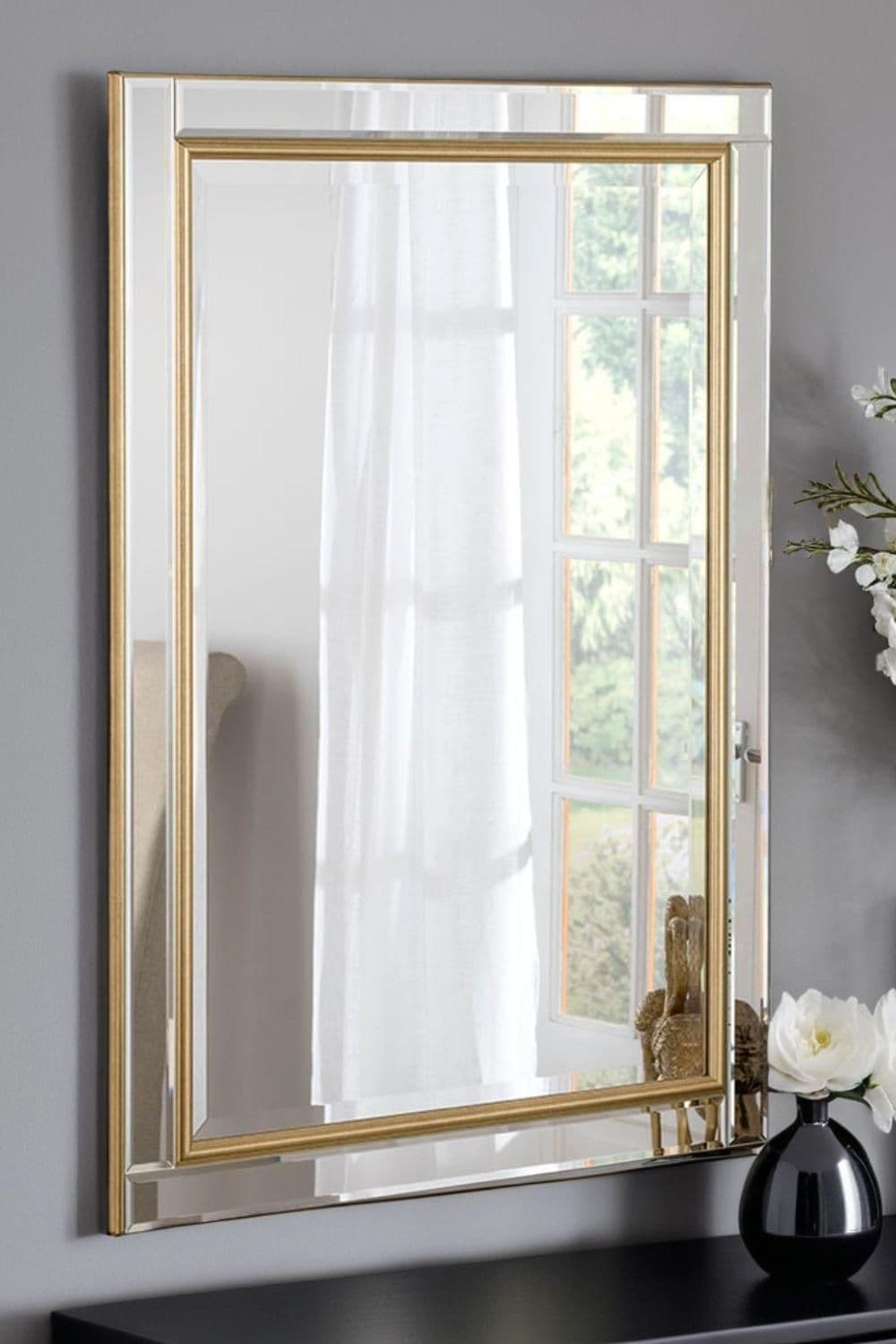 Brass framed bevelled mirror 90.5x65cm